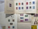 a lot of different stamps on the pages of a book