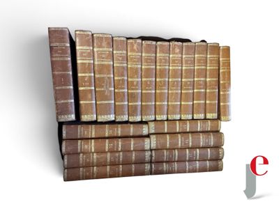 many old books stacked on top of each other