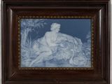 framed blue and white picture of a naked man sitting on a rock
