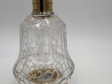 an old fashioned glass perfume bottle with gold trimming