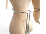 a mannequin with a metal holder on it ' s back