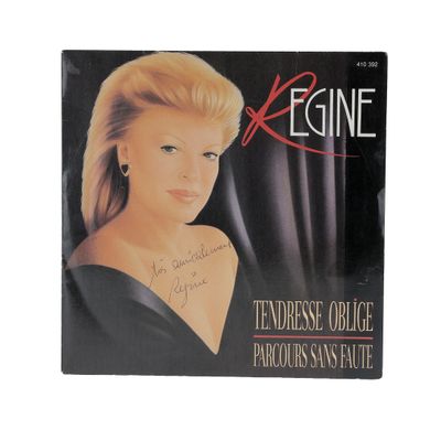 the cover of a magazine with a picture of a woman in a black dress