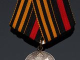 a close up of a medal with a ribbon around it
