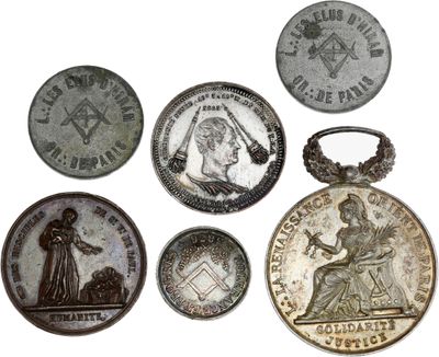 several different types of coins are shown on a white surface