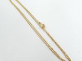 a gold chain with a heart charm on it