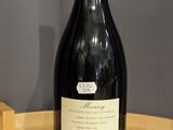 a bottle of wine that is sitting on a table