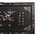 a black box with a floral design on it