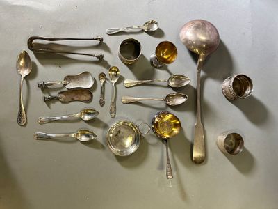a lot of silver spoons and spoon spoons on the table