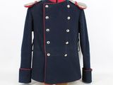 a blue coat with red trims and buttons on a mannequin dummy