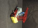 a toy truck that is attached to the back of a car