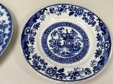 two plates with blue and white designs on them