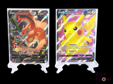 two pokemon cards sitting side by side on top of each other