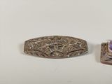 two silver and amethorate brooches and a ring
