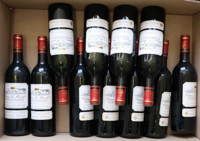 many bottles of wine sitting in a box together