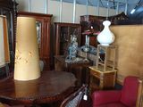 a table with a lamp on top of it in a room