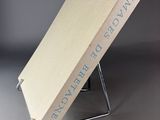 a book that is sitting on top of a metal stand
