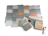a pile of old letters and envelopes sitting on a table