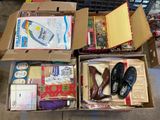 two boxes of shoes and a pair of shoes in them
