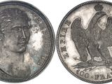 une image représentant une pièce d'argent sur laquelle figure un aigle