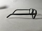 a pair of glasses sitting on a white surface