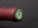 a close up of a bottle of wine on a table