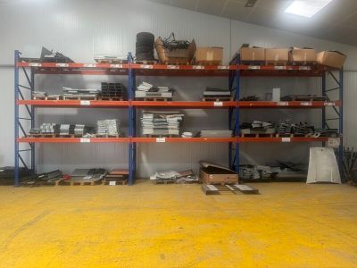 a large room with a lot of shelves and boxes on it