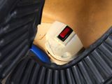 a close up of a toilet with a brush in it