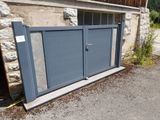 a garage door that is open on the side of a building
