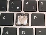 a close up of a computer keyboard with a chip on it