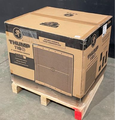 a cardboard box sitting on a pallet in the middle of the floor