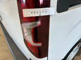 a close up of the tail light of a white van