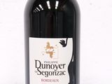 a bottle of wine that is sitting on a table