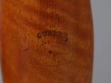 a close up of a wooden baseball bat with a logo on it