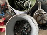 a bucket full of screws and nuts on a table