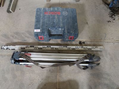a picture of a tool box and a tripod in a garage
