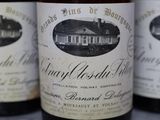 several bottles of wine are lined up on a table
