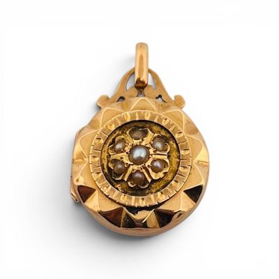 Pendentif secret circulaire en or jaune 18K (750) à décor d'…