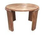 the table is made out of wood and has a round top