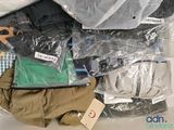 a pile of clothing that is sitting on a table