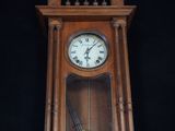 a clock that is on the wall with a gun in it