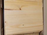 a box that has a piece of wood in it