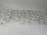 a lot of empty wine glasses sitting on a table