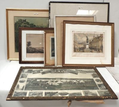 many framed pictures on a table with pictures on it