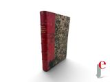 an old book with a red cover sitting on top of a white surface