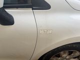 a white car with a sticker on the side of it