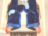 a picture of a statue of a man sitting on a chair
