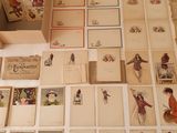 a lot of cards on the table with a box of them