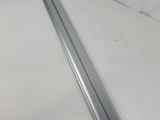 a close up of a piece of metal on a white surface