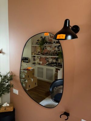 a bathroom with a sink and a mirror on the wall