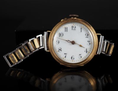 an image of a close up of a wrist watch on a black surface